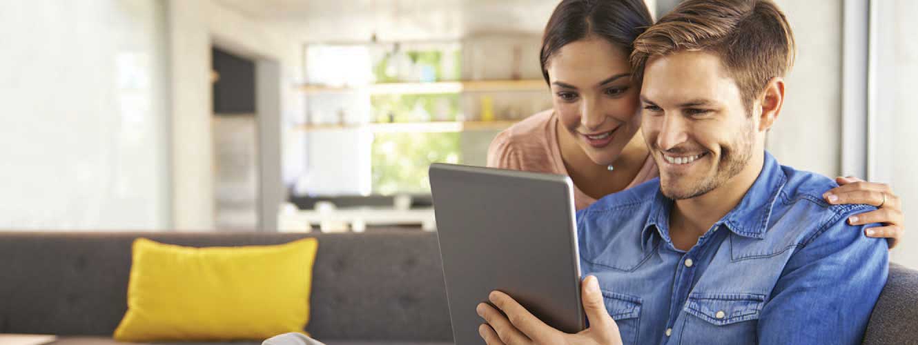 Couple looking at tablet together